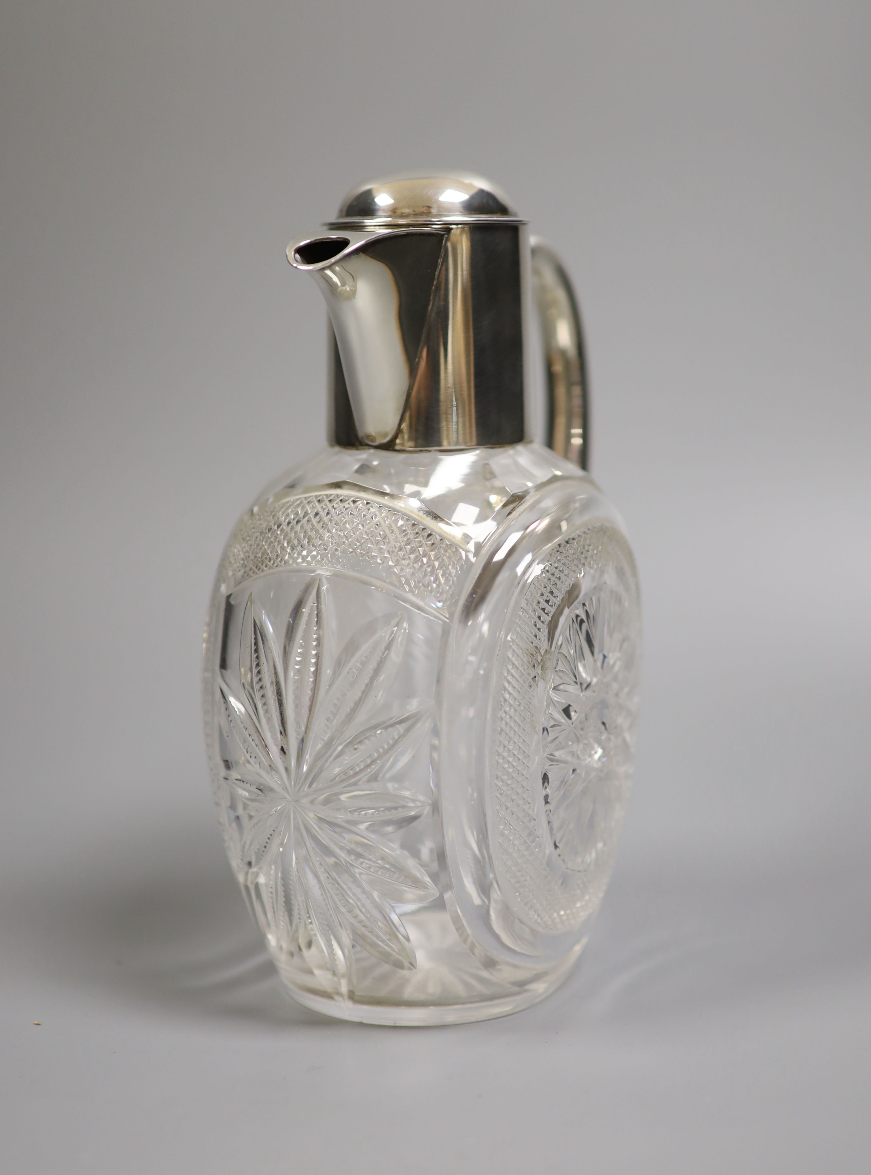 A late Victorian silver mounted cut glass claret jug, Hukin & Heath, Birmingham, 1898, 20.4cm.